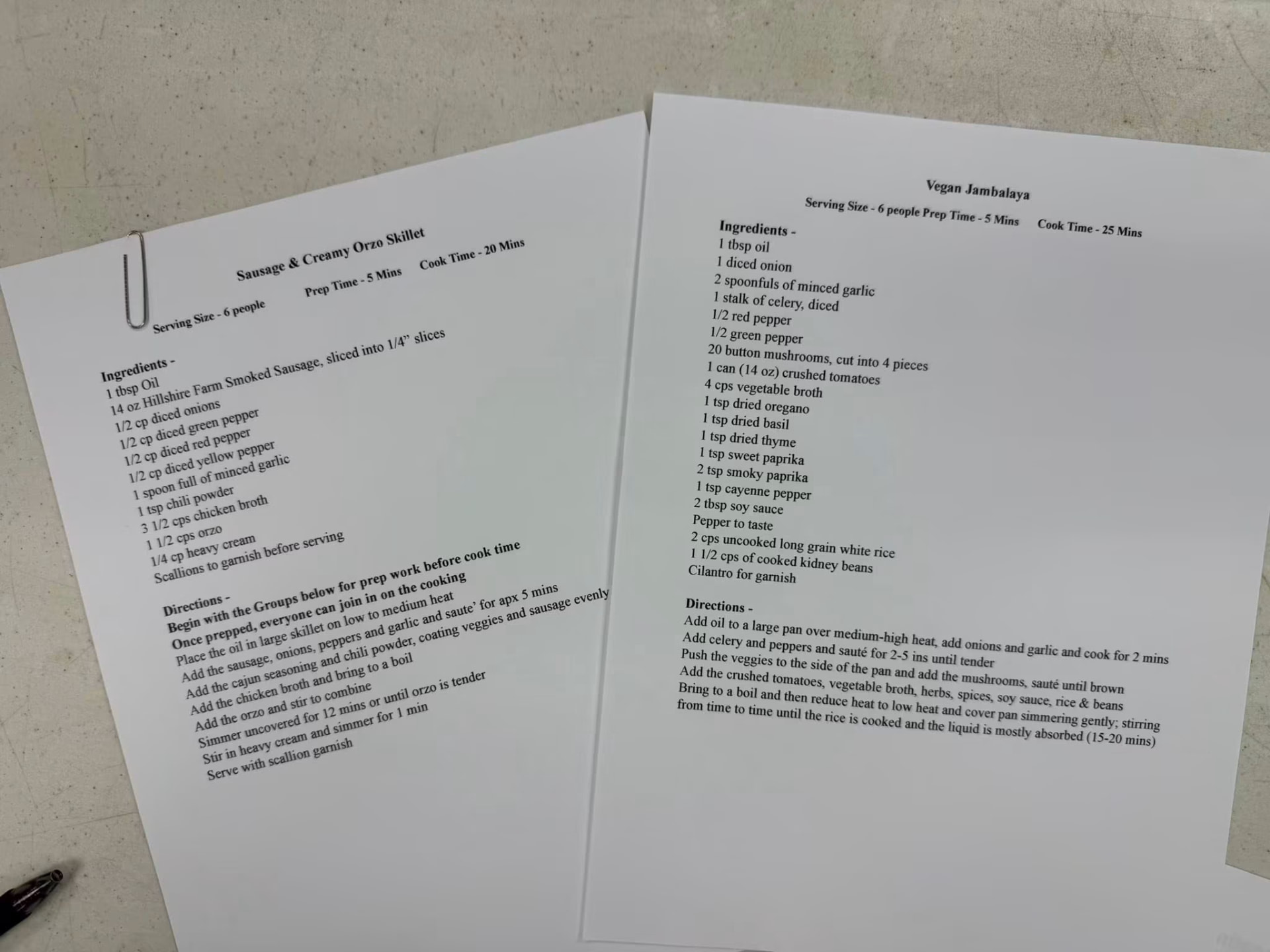 Printed recipe sheets for sausage orzo skillet and vegan jambalaya