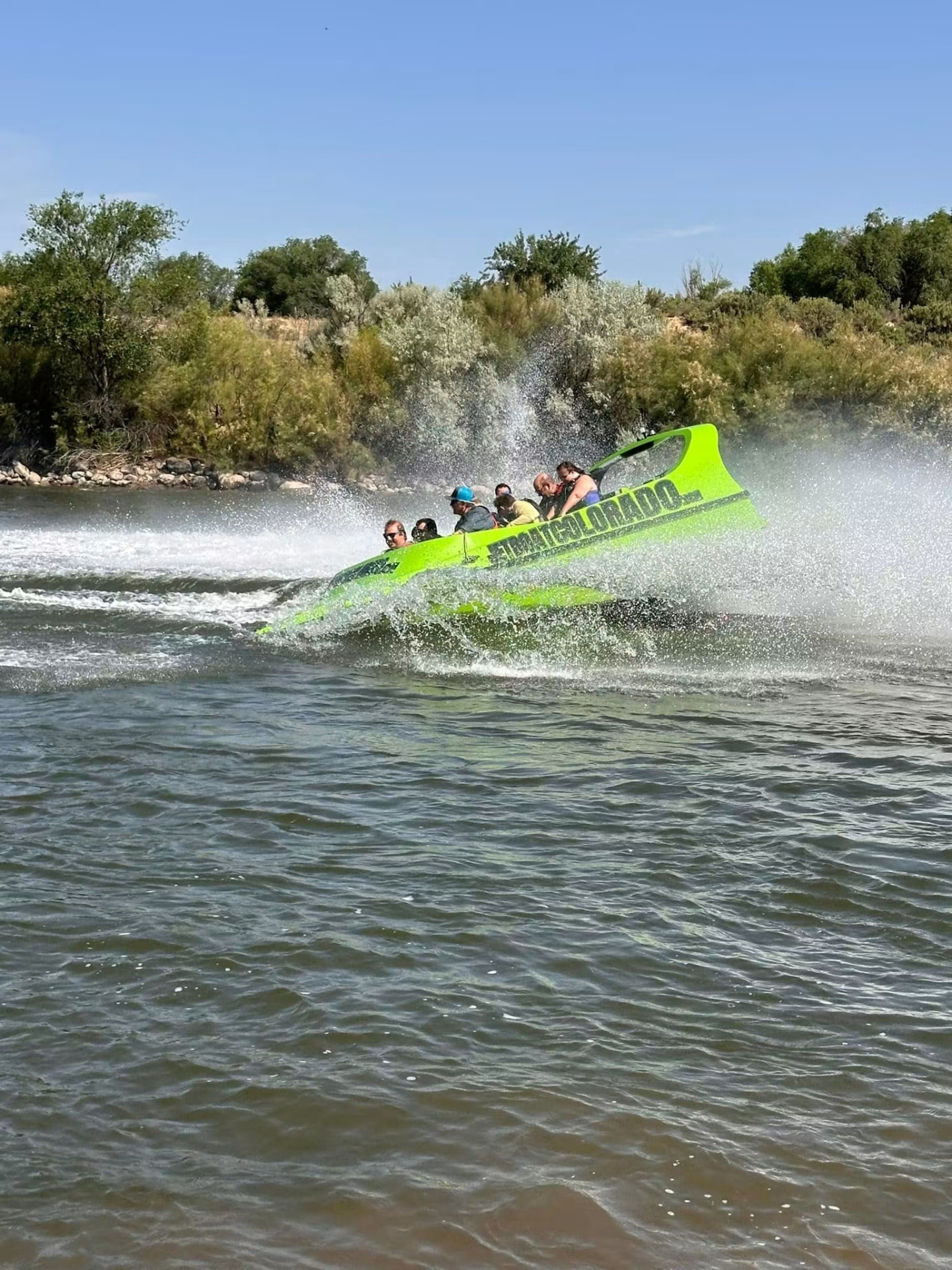 A jet boat spraying water on the Colorado River